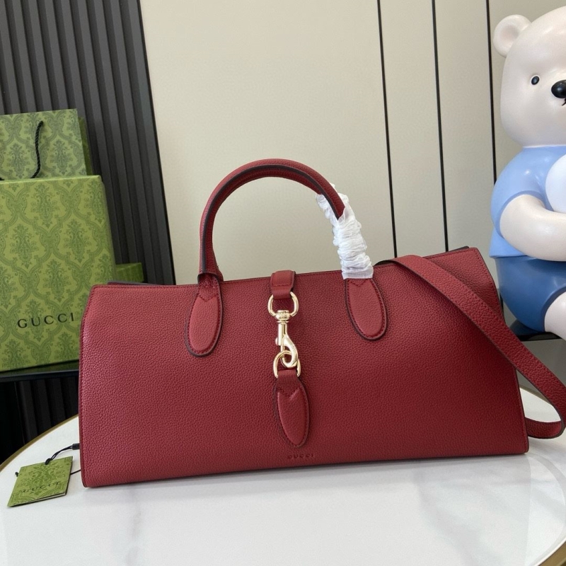 G*u*i top handle bags